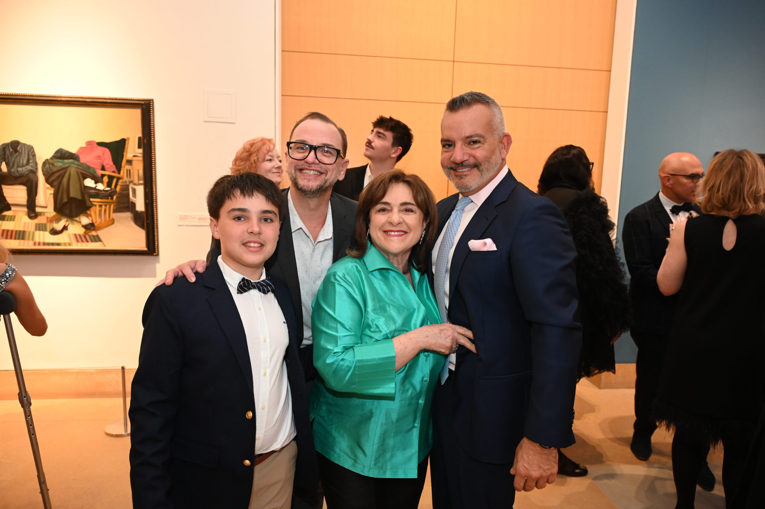 4 people smiling and posing for a photograph