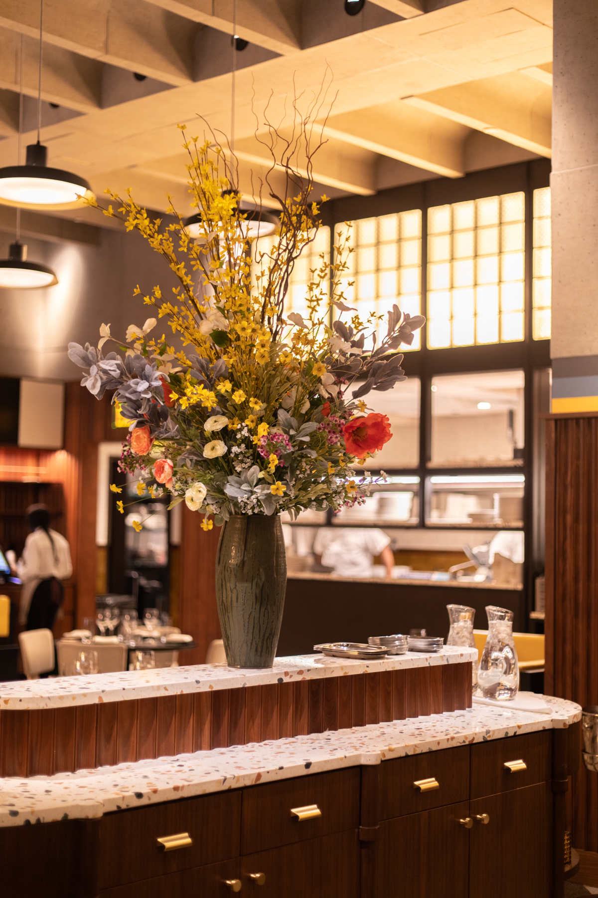 large flower bouquet on restaurant dining table 