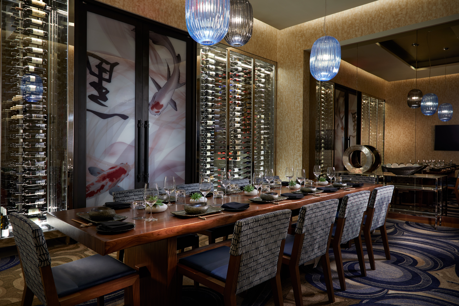 restaurant tables with Japanese artwork on the walls 
