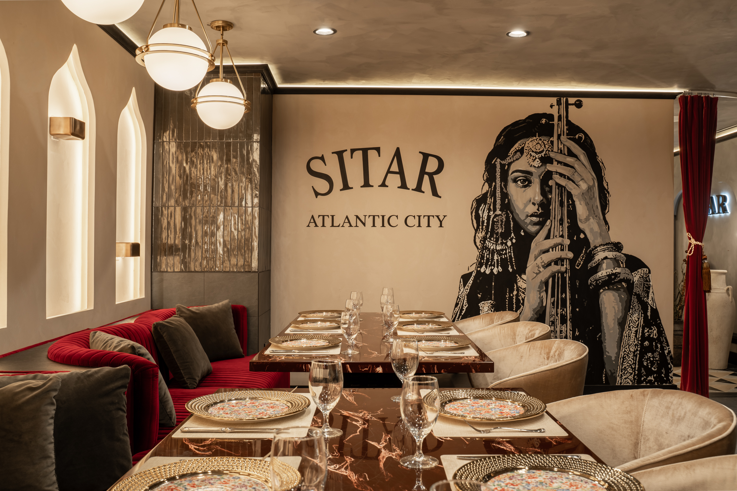 Dining table with shot of Sitar logo on wall