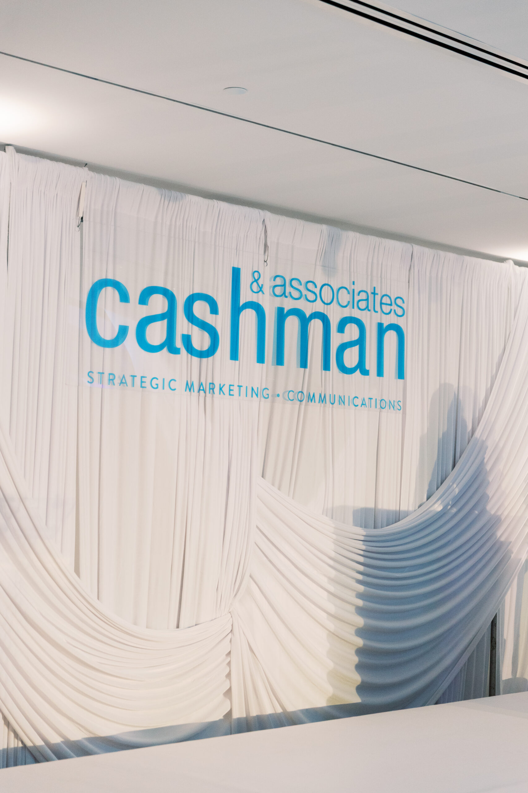Cashman & Associates branded stage backdrop